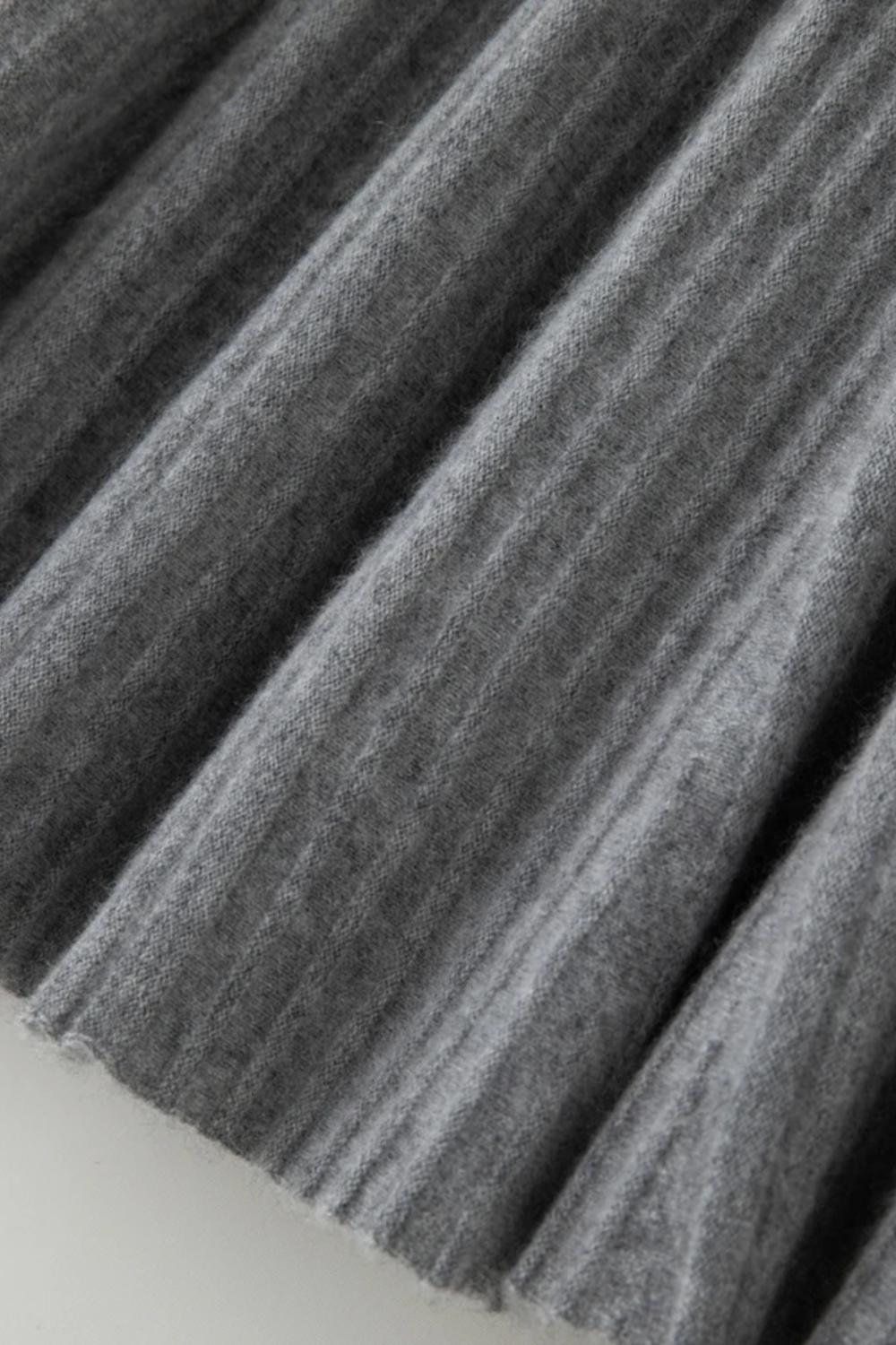 Close-up of pleated fabric with a textured pattern