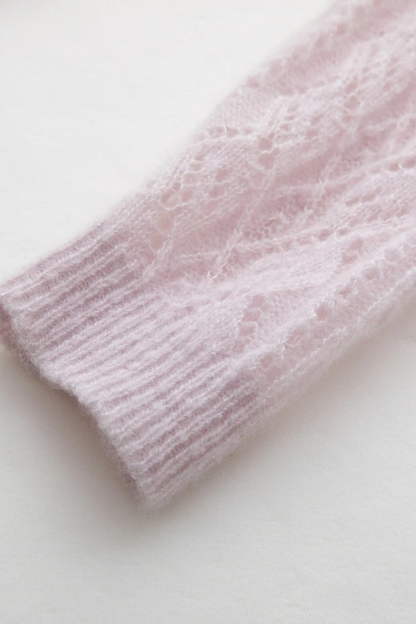 Close-up of a pink knitted fabric on a white background