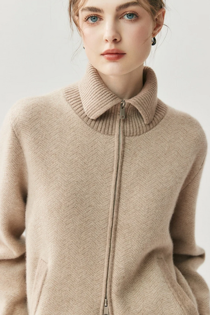 Camel zip-up sweater worn by a model on a light background