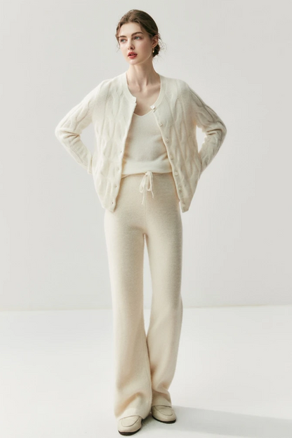 Woman wearing a white knit outfit on a white background