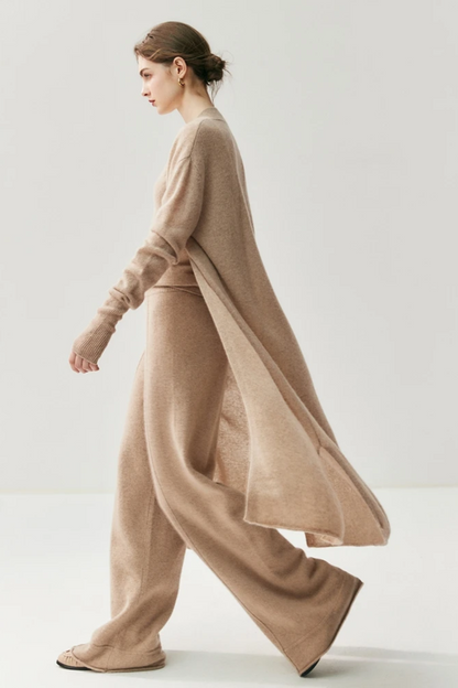 Woman wearing a camel sweater and pants set on a white background