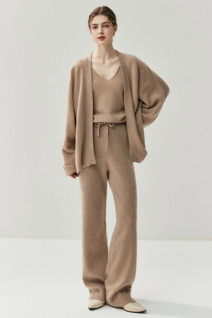 Woman wearing a camel-coloured knit outfit on a white background