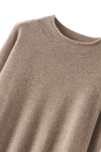 Close-up of a camel sweater on a white background