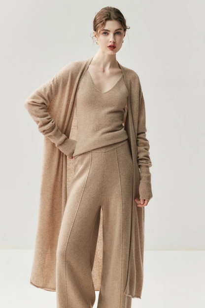 Woman wearing a camel sweater and pants set on a white background