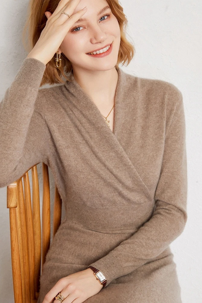 Woman wearing a beige dress against a light background