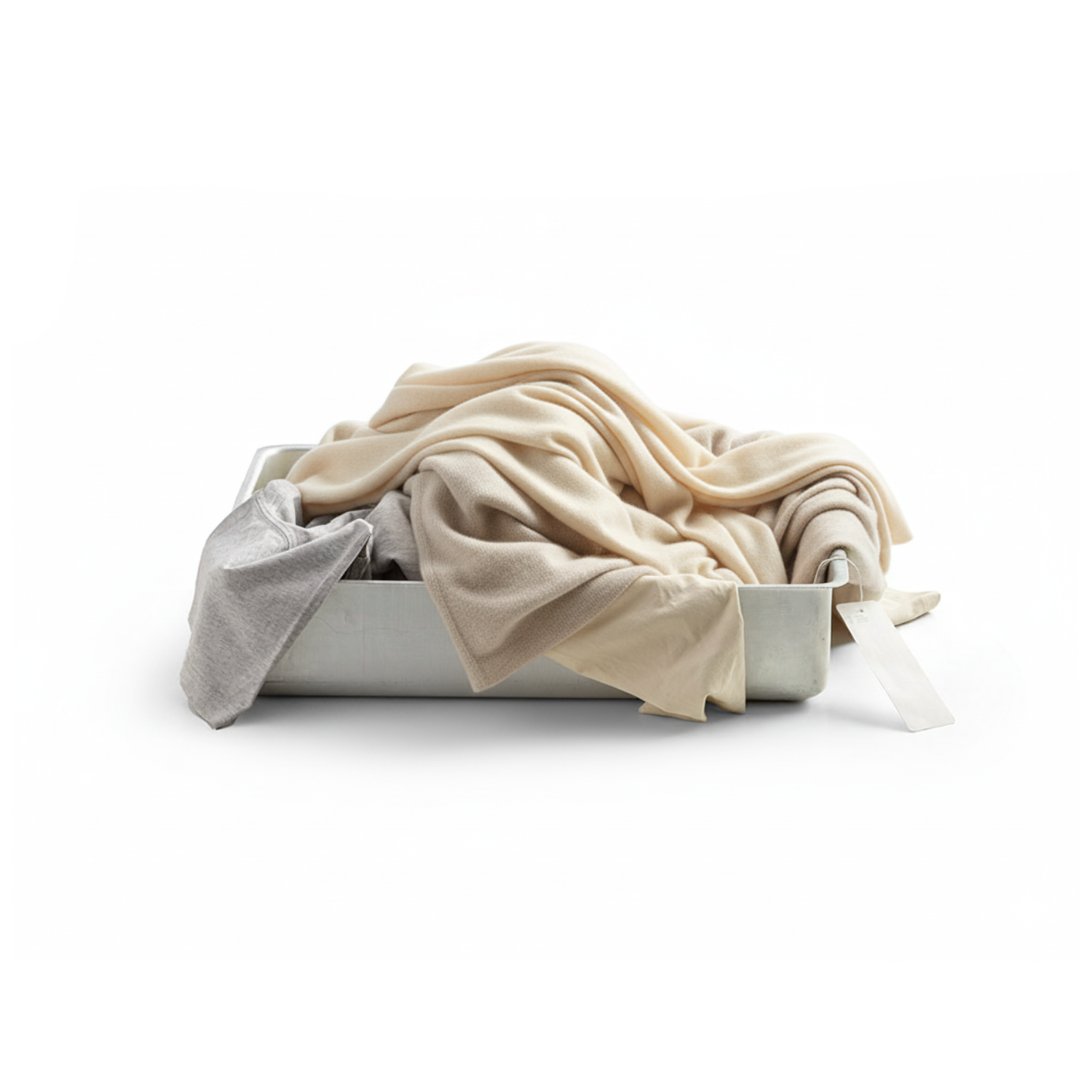 Folded beige and gray fabric in a white container on a white background